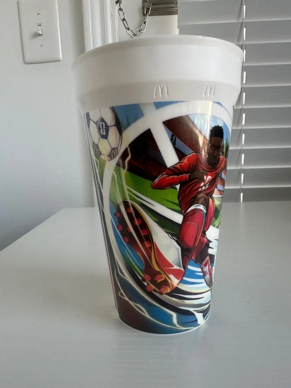 McDonald's 2026 FIFA World Cup collectible cup featuring Alphonso Davies
